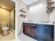 Bathroom featuring a double sink vanity with granite countertop and tiled walk-in shower at 6 Escondido Cir # 64, Altamonte Springs, FL 32701