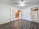 Light-filled bedroom with luxury vinyl plank flooring, french doors, and closet at 6 Escondido Cir # 64, Altamonte Springs, FL 32701