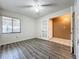 Bright bedroom with neutral walls, luxury vinyl plank flooring, and large window at 6 Escondido Cir # 64, Altamonte Springs, FL 32701