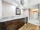 Dining room showcasing built-in dark wood cabinetry with beautiful granite countertops at 6 Escondido Cir # 64, Altamonte Springs, FL 32701