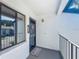 Inviting condo entrance with a decorative door and a view of the surrounding landscape at 6 Escondido Cir # 64, Altamonte Springs, FL 32701