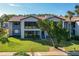 Exterior view of this beautiful condo with lush landscaping, mature trees, and manicured lawns at 6 Escondido Cir # 64, Altamonte Springs, FL 32701