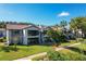 Charming two-story condo with lush lawn, walkway, and mature landscaping at 6 Escondido Cir # 64, Altamonte Springs, FL 32701
