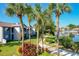 Exterior featuring lake views and green space, complemented by mature trees and landscaping at 6 Escondido Cir # 64, Altamonte Springs, FL 32701