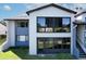 Condo exterior with large windows offering views of the lush surroundings and plenty of natural light at 6 Escondido Cir # 64, Altamonte Springs, FL 32701