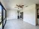 Spacious Florida room with tile floors, ceiling fan, closet and access to the outside at 6 Escondido Cir # 64, Altamonte Springs, FL 32701