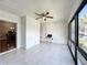 Bright Florida room with tile flooring, ceiling fan and open view to adjacent dining room at 6 Escondido Cir # 64, Altamonte Springs, FL 32701