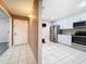 Bright kitchen with white cabinets, stainless steel appliances, and tile flooring in a well-maintained layout at 6 Escondido Cir # 64, Altamonte Springs, FL 32701