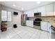 Bright kitchen featuring white cabinets, stainless steel appliances, and granite countertops at 6 Escondido Cir # 64, Altamonte Springs, FL 32701