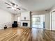Spacious living area with hardwood floors, fireplace, sliding glass doors, and lots of natural light at 6 Escondido Cir # 64, Altamonte Springs, FL 32701