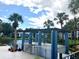 Scenic outdoor area featuring pergola, lake, lush landscape and trees at 6 Escondido Cir # 64, Altamonte Springs, FL 32701