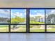 Serene view of lake and lush landscaping from a large window, bringing the outdoors in at 6 Escondido Cir # 64, Altamonte Springs, FL 32701
