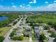 Beautiful aerial view of a residential neighborhood with mature trees, a community lake, and well-maintained homes at 610 Carey Way, Orlando, FL 32825
