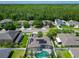 An aerial view of a home with solar panels and a screened-in pool in a suburban neighborhood at 610 Carey Way, Orlando, FL 32825