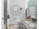 Well-lit bathroom with granite countertops, a neutral color palette, and modern fixtures at 610 Carey Way, Orlando, FL 32825