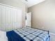 Simple bedroom with large closet and neutral tones, offering a peaceful retreat at 610 Carey Way, Orlando, FL 32825