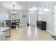 Open dining area showcasing a chandelier and furniture set at 610 Carey Way, Orlando, FL 32825