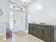 Welcoming foyer with tiled flooring, a decorative table, and a view of the front door with sidelights at 610 Carey Way, Orlando, FL 32825
