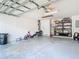 A bright garage space with a door leading inside, offering lots of room for storage and hobbies at 610 Carey Way, Orlando, FL 32825