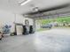 Spacious two-car garage with an automatic door opener offering access to the home's front yard at 610 Carey Way, Orlando, FL 32825