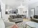 Inviting living room with cozy seating and stylish decor, open to the kitchen area at 610 Carey Way, Orlando, FL 32825