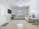 Bright living room featuring a ceiling fan, a cozy couch, and neutral colors at 610 Carey Way, Orlando, FL 32825