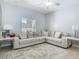 Bright living room featuring a ceiling fan and a comfortable sectional sofa at 610 Carey Way, Orlando, FL 32825