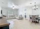 Bright and open living room featuring tile floors, neutral walls, and a comfortable seating area with natural light at 610 Carey Way, Orlando, FL 32825