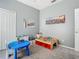 Spacious playroom with toys and neutral walls, perfect for creative play at 610 Carey Way, Orlando, FL 32825