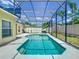 A private swimming pool with a screened enclosure, perfect for outdoor enjoyment and relaxation at 610 Carey Way, Orlando, FL 32825