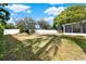 Spacious backyard with large grass lawn and newly installed white vinyl fence line at 650 Sweetbriar Br, Longwood, FL 32750