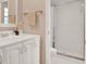 Bright bathroom with white vanity, countertop, and walk-in shower with sliding glass door at 650 Sweetbriar Br, Longwood, FL 32750