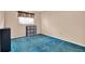 Bedroom showcasing a large window, blue carpet, and ample natural light at 650 Sweetbriar Br, Longwood, FL 32750