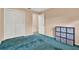 Bedroom features blue carpet, a closet with white louvered doors, and neutral walls at 650 Sweetbriar Br, Longwood, FL 32750