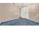 Bedroom view with neutral walls, a door to another room, and blue carpet at 650 Sweetbriar Br, Longwood, FL 32750