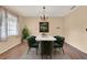 Cozy dining room with a marble table, seating for six, and a tranquil plant accent at 650 Sweetbriar Br, Longwood, FL 32750