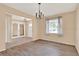 Charming dining room features new flooring, a chandelier and a window with natural light at 650 Sweetbriar Br, Longwood, FL 32750