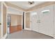 Bright foyer featuring double doors, carpet, and neutral walls, creating a welcoming entry at 650 Sweetbriar Br, Longwood, FL 32750