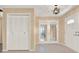 Hallway with closet, leading to the foyer, showcasing a transition between living spaces at 650 Sweetbriar Br, Longwood, FL 32750