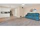 Spacious living room featuring wood floors, leading to an open kitchen and comfortable seating area at 650 Sweetbriar Br, Longwood, FL 32750
