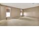 Spacious living room showcasing a wall of windows and neutral carpeting at 650 Sweetbriar Br, Longwood, FL 32750