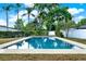 Backyard pool surrounded by lush landscaping, patio area, and mature trees at 650 Sweetbriar Br, Longwood, FL 32750