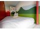 Interior view of the top bunk in the mushroom bed with themed decorations enhancing the whimsical atmosphere at 7618 Oakmoss Loop, Davenport, FL 33837