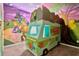 Fun bedroom featuring custom themed mural and a van shaped bed at 7618 Oakmoss Loop, Davenport, FL 33837