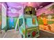 Charming bedroom with custom mural and van shaped bed at 7618 Oakmoss Loop, Davenport, FL 33837
