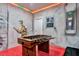 Themed game room with foosball table, custom mural, and unique decor at 7618 Oakmoss Loop, Davenport, FL 33837