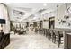 Luxurious lounge area features stylish decor, comfortable seating, and a welcoming atmosphere at 7618 Oakmoss Loop, Davenport, FL 33837