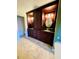Bathroom boasts dark cabinetry, double sinks, oval mirrors, and tile flooring, creating a sophisticated design at 7629 Chapelhill Dr, Orlando, FL 32819