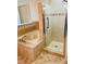 Bathroom featuring a shower with glass door and a soaking tub with tile surround and accent tile at 7629 Chapelhill Dr, Orlando, FL 32819