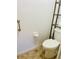 Toilet area features handrails and a toilet paper holder, offering convenience and safety in the bathroom at 7629 Chapelhill Dr, Orlando, FL 32819